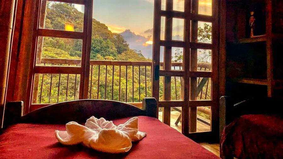 Room window with mountain sunset view