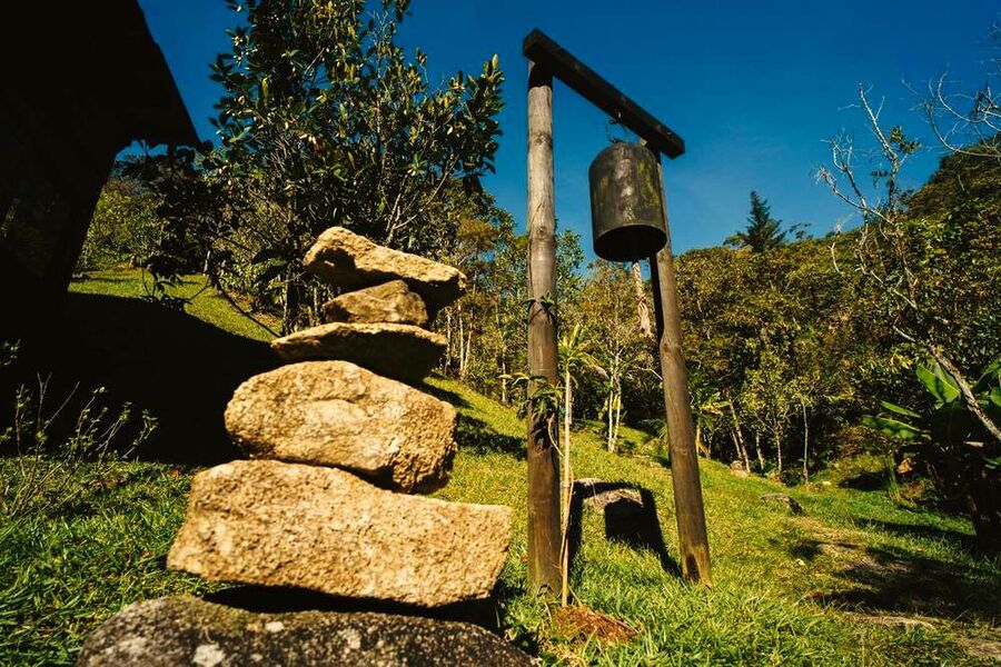 Stacked stones and a hanging bell in the garden