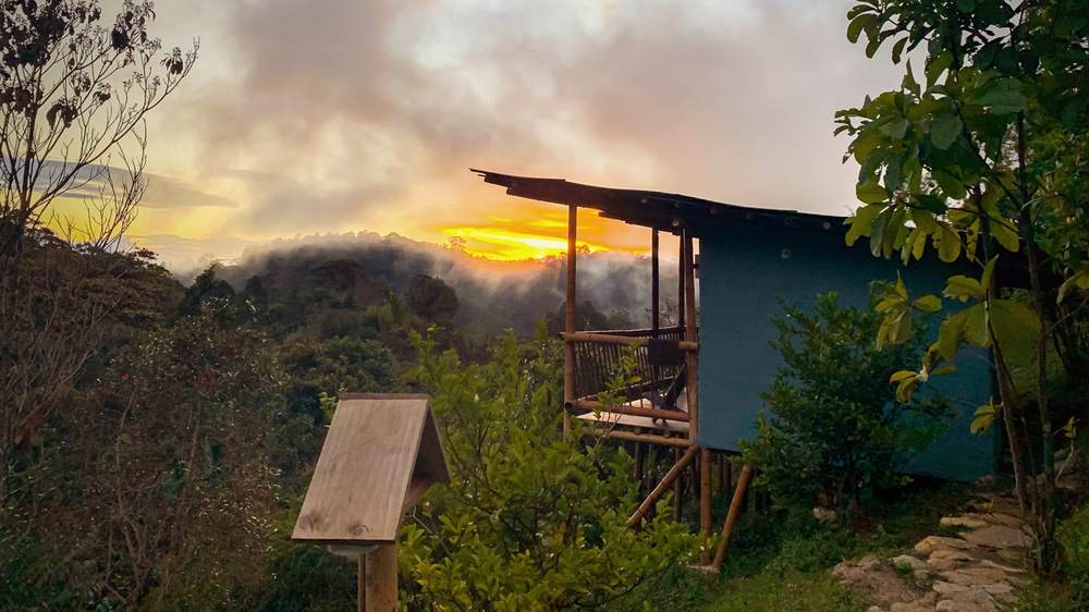 Shared Twin Room cabin exterior at sunset